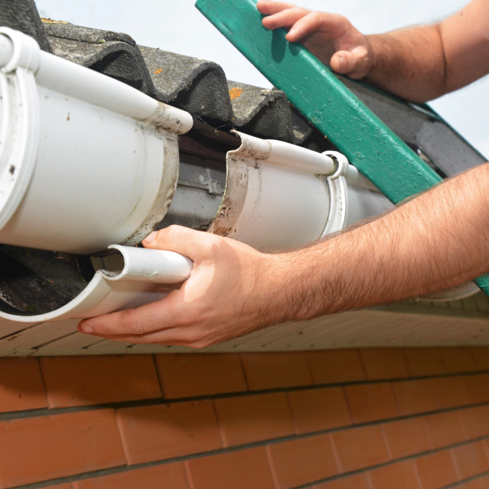 hands of a contractor doing a gutter repair santa clara ca