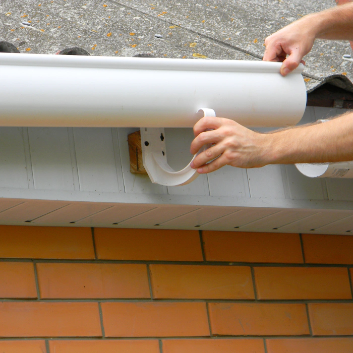 hands of a contractor during a gutter installation santa clara ca